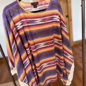 Striped Poncho with fringe detail.  One Size Fits All